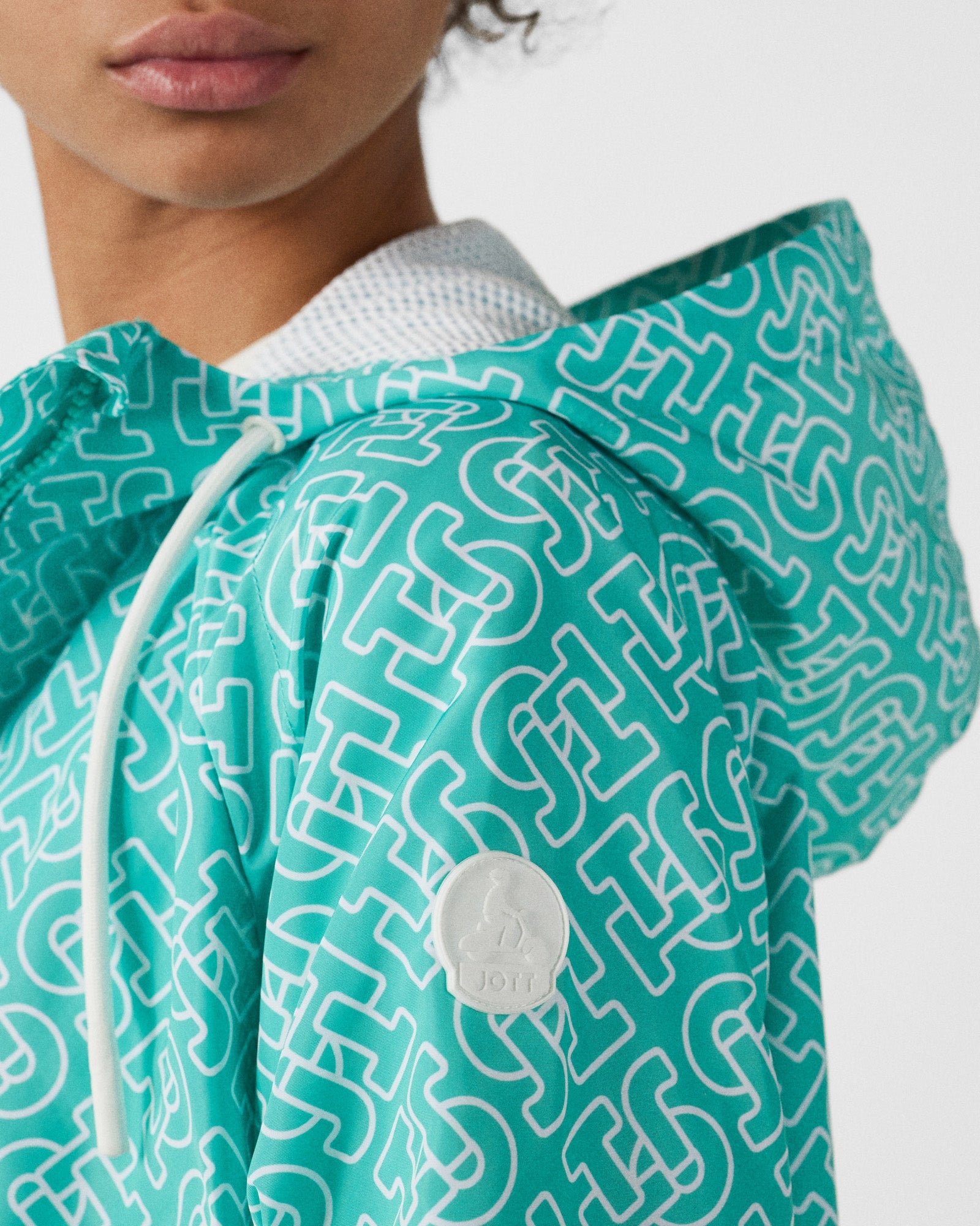 Blouson coupe-vent léger à capuche Mono lagon Alize monogram